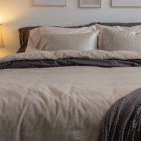 Photo of a bedroom with a plush bed featuring a QuickZip Sand Flannel Fitted Sheet and New-Way Du...