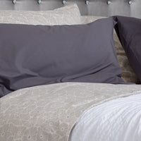 Photo of a bedding highlighting the play of solid, print, and texture to create the perfect spot ...