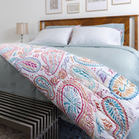 A photo of a full bedding set comprised of a Dusty Blue Sateen duvet cover and a variety of pillo...