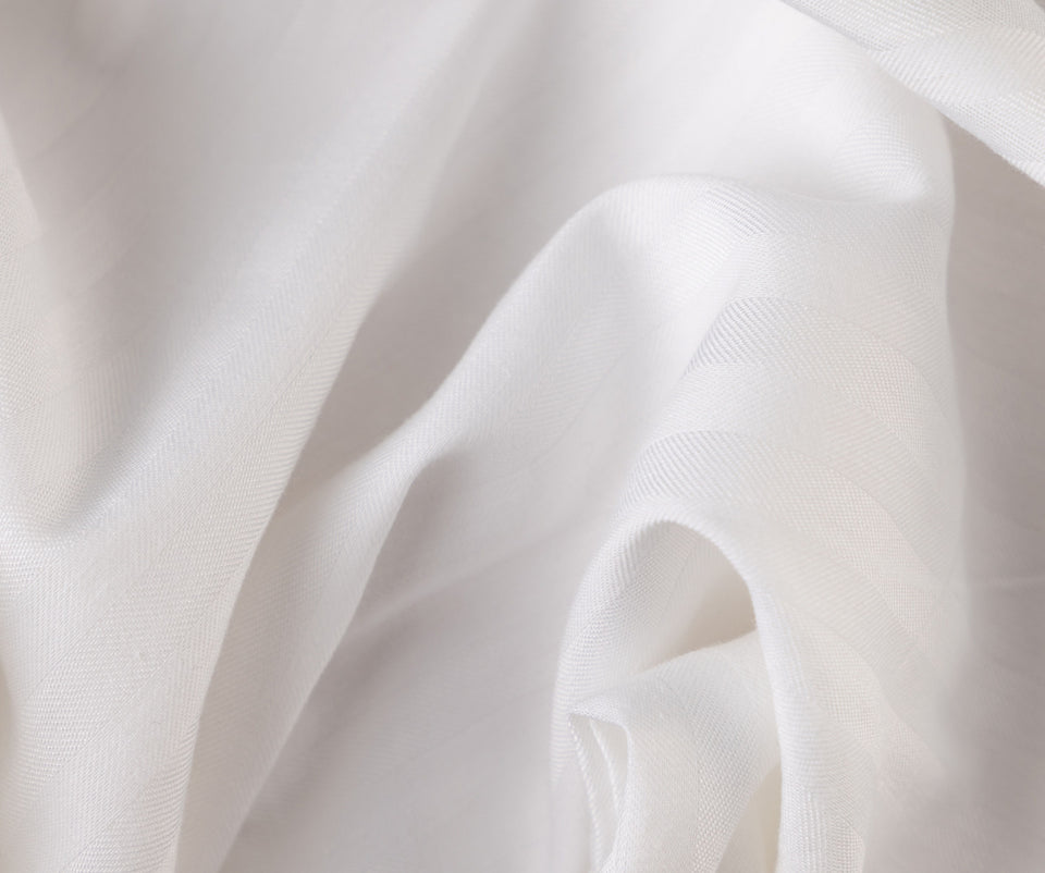 Close-up of white ComfortCore Sateen Stripe fabric